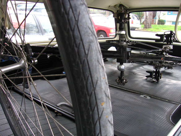 No problem!  Tandem is inside the car; fits with all doors and windows shut.  Bike is completely assembled with wheels, fenders, rear rack, pedals, seats, and handlebars.